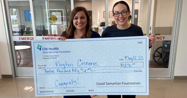 Last year, Payton Cisneros (left), manager, Emergency Department was one of 26 recipients to receive a scholarship from Good Samaritan to help further her education. Shelby Shipp (right), chair, Nursing Shared Governance Council presented Cisneros with a ceremonial check.