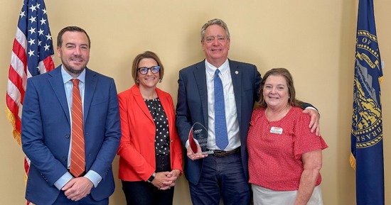 AARP Nebraska’s Jina Ragland, Associate State Director of Advocacy and Outreach, and Suzan DeCamp, Volunteer State President, gather with Senator Robert Dover and Eric Gerrad of ACG, Inc. for the inaugural Community Fraud Fighter Award presentation. 