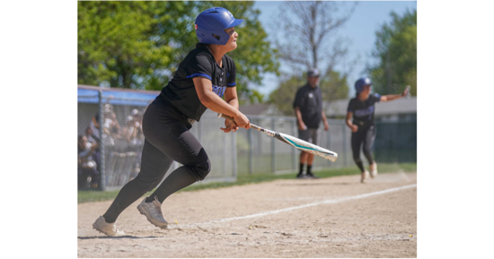 MCC’s Rocio Mascorro watches the flight of her game-winning hit sail safely into right field as Laila Gutierrez scores the game-winning run Saturday in a 2-1 win in extra innings.