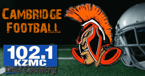 Football field in the background with the Cambridge Mascot on the right, the words Cambridge football on the upper left corner and the KZMC-FM 102.1 logo on the bottom right.